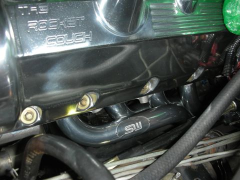 1992 Ford Crown Victoria - Engine components including a chrome valve cover and exhaust headers are visible in this close-up shot.