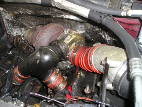 1997 Ford F-250 - Turbocharger and intake piping are visible in this engine bay detail shot.