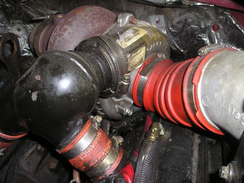 1997 Ford F-250 - This image shows a close-up view of a turbocharger and associated intake piping, not a specific vehicle model year.