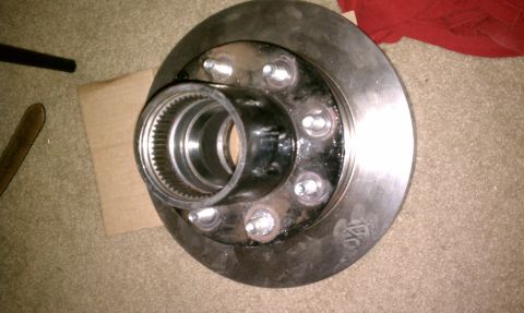 1990 Ford Bronco - Close-up of a brake rotor and hub assembly, showing the splined interior of the hub.