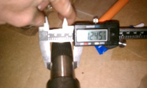 1990 Ford Bronco - A digital caliper measures a splined shaft, displaying a reading of 1.245 inches.