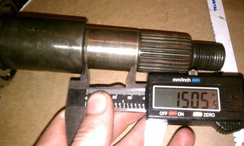 1990 Ford Bronco - A splined shaft is measured with digital calipers, showing a reading of 1.505 inches.