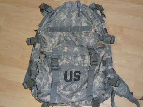 1992 Ford Mustang - A digital camouflage backpack with "US" printed on the front, multiple buckles and straps.
