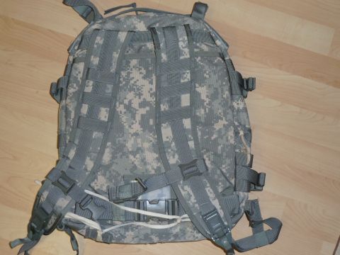 1992 Ford Mustang - Military backpack with digital camouflage pattern and adjustable straps.