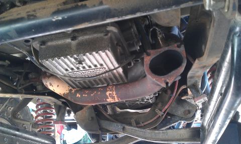 1992 Ford Ranger - A view from beneath a vehicle reveals its transmission and exhaust system, with visible signs of wear and wear.
