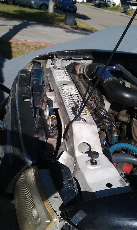 1992 Ford Ranger - Close-up of the engine bay of a 1992 Ford Ranger, focusing on the radiator support structure.