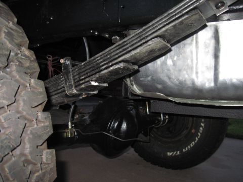 1979 Ford Bronco - Close-up view of the rear axle and suspension system on a 1979 Ford Bronco, highlighting the leaf springs and differential.