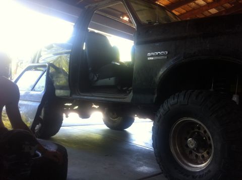 1990 Ford Bronco - This 1990 Ford Bronco is parked inside a garage with its doors open.