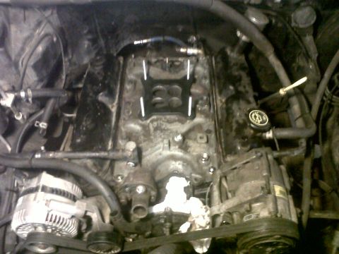 1994 Ford F-150 - Close-up view of a vehicle's engine bay, showing various components and wiring.