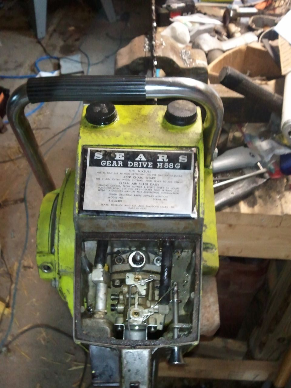 Yellow Sears Gear Drive H58G chainsaw with exposed engine components