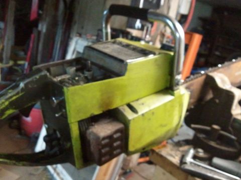 1985 Ford F-150 - A yellow chainsaw is shown in a workshop setting.