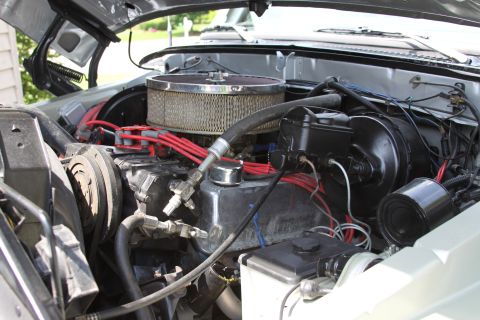 1979 Ford Bronco - Close-up view of an engine bay, showing various components and wiring. Watermark present.