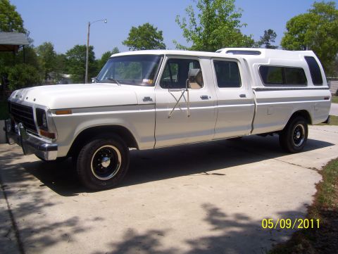 1978 Ford Bronco - This 1978 Ford F-350 crew cab pickup truck is equipped with a camper shell, offering a unique side profile.