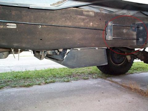1992 Ford Bronco - On the rear of the driver's side there are bolts through the frame for the fuel filter bracket. Remove both of these, you will be able to p…
