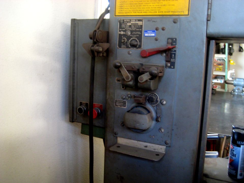 Industrial machine control panel with levers and dials