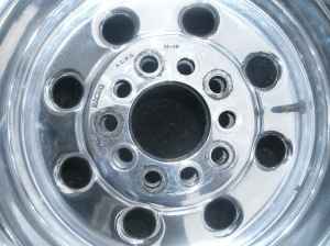 1966 Ford Fairlane - A close-up view of a vehicle's wheel, showing its design and the 'SUPER MOTORS' logo.