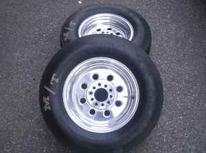 1966 Ford Fairlane - Two drag racing tires and wheels are shown from a top-down perspective.