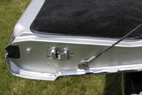 1979 Ford Bronco - Tailgate latch mechanism and carpeted area shown in detail.