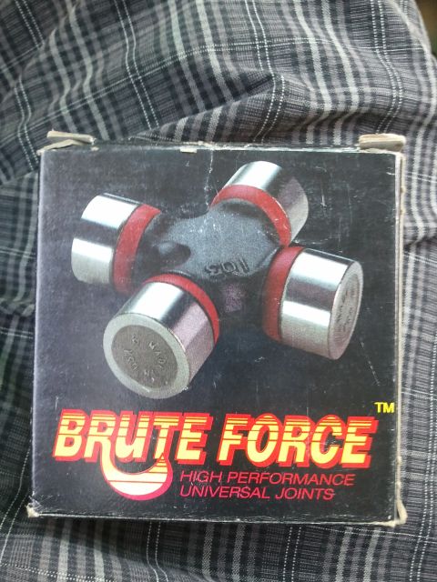 1982 Ford Bronco - A new universal joint is shown in its packaging, ready for installation.