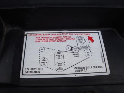 1989 Ford Bronco - Underhood 7.5L drive belt routing label showing the serpentine belt path over alternator, water pump, A/C and crankshaft pulleys.