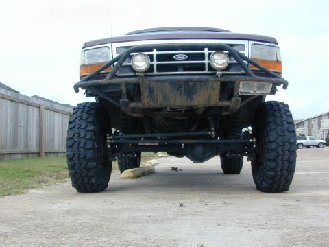 1996 Ford Bronco - Front view of a heavily modified 1992 Ford Bronco with off-road tires and a custom bumper.