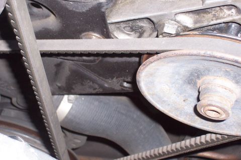 1988 Ford Bronco - A close-up view of the engine's belt and pulley system.