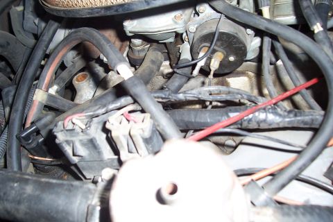 1988 Ford Bronco - Engine bay detail with carburetor and various hoses and electrical connections visible.