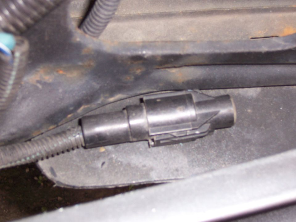 OK, where to mount the temperature sensor.  I initially mounted it on the radiator support just to the left, (as looking at the truck from the front), of the headlight.  The intent was to keep it out of the air flow, more about that in the next picture.  Here it is in the final location, mounted on the frot edge of the plastic wheelwell splash guard.