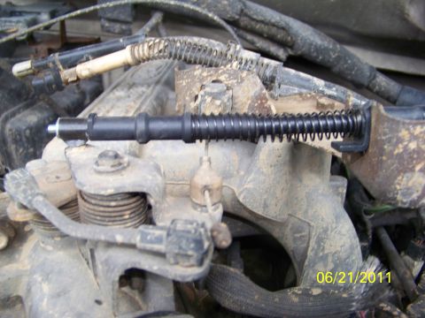 1989 Ford Bronco - A close-up view of an engine component, a spring mechanism and a timestamp from 2011.