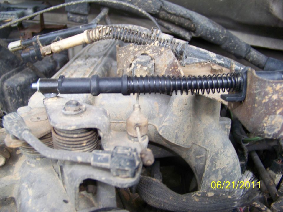 Close-up of engine part with spring and date stamp 06/21/2011