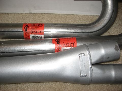 1994 Ford Bronco - Close-up of exhaust pipes, red labels with the part number 42321 and "Made in USA" text.