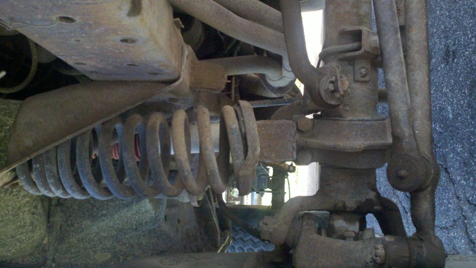 1978 Ford Bronco front suspension coil spring and steering linkage