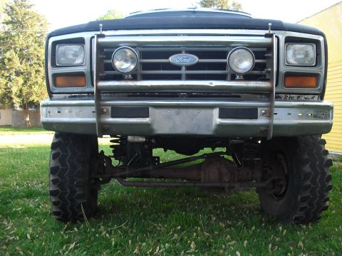 1986 Ford Bronco - Front view of a 1986 Ford Bronco showing its grille, headlights, and bull bar.