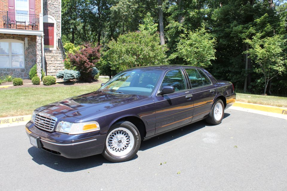 Dark purple 1998 Ford Crown Victoria 3q-front view