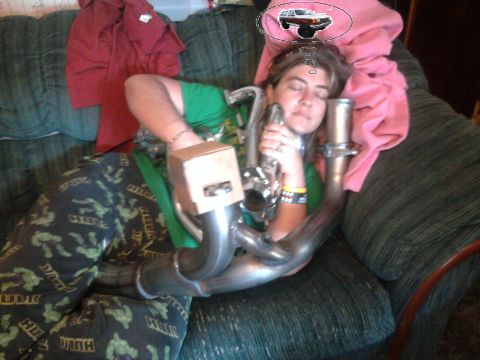 1989 Ford Bronco - Person sleeping on a couch, dreaming of a vehicle, while holding an exhaust pipe part.