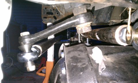 1990 Ford Bronco - Undercarriage view of steering linkage and suspension components, possibly from a Ford Bronco.