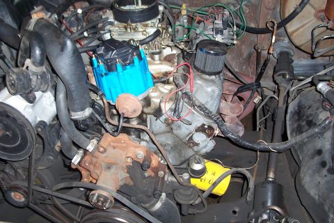 1988 Ford Bronco - Close-up view of a vehicle's engine bay, showing various components and wiring.