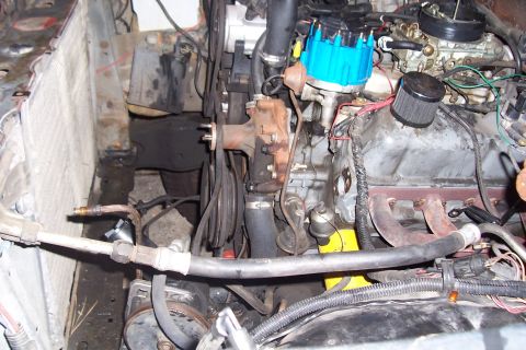 1988 Ford Bronco - Close-up view of a vehicle's engine compartment, showing various components and wiring.