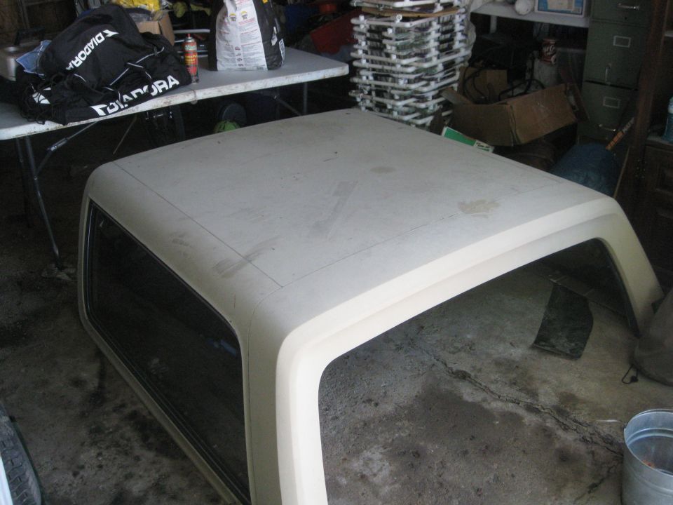 Ford Bronco hardtop removed from vehicle, sitting on concrete floor