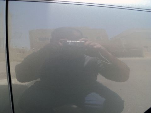2001 Mercury Grand Marquis - Reflection of photographer in the side door of a 2001 Mercury Grand Marquis.