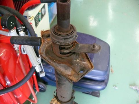 1976 Chevrolet Corvette - This rusty steering column component appears to be from a vehicle, but its specific make and model are not identifiable from the image.