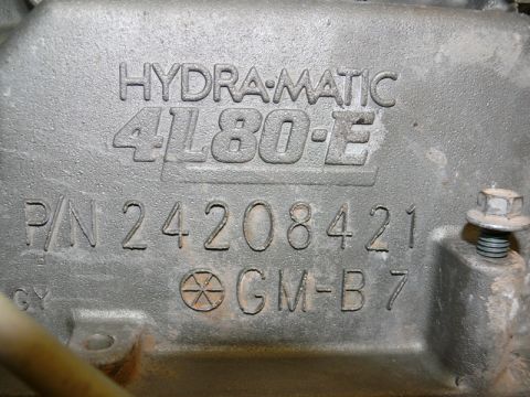 1976 Chevrolet Corvette - This image shows a close-up of a transmission part with its identification numbers clearly stamped.