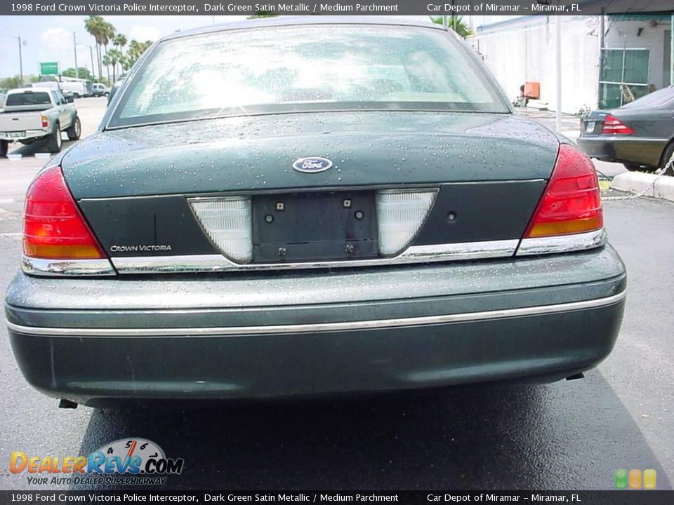 Rear view of a 1998 Ford Crown Victoria Police Interceptor. Taillights and Ford emblem visible