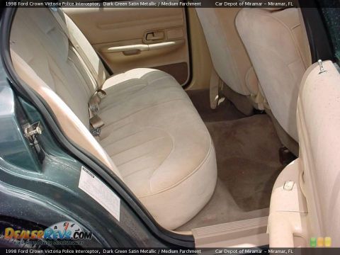 1998 Ford Crown Victoria - Interior view of a 1998 Ford Crown Victoria, highlighting the tan upholstery and door trim.