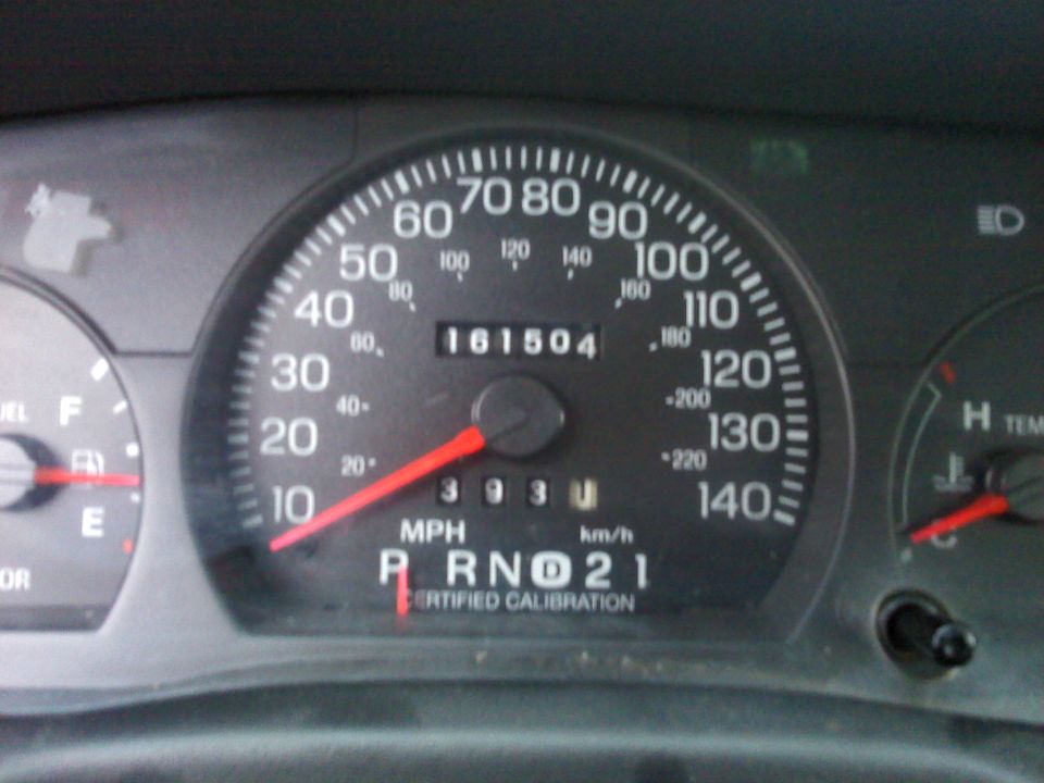 Speedometer reads 161,504 miles. Gear selector shows P, R, N, D, 2, 1