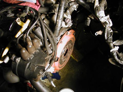 1996 Ford Probe - Engine bay detail a clutch and distributor assembly with associated wiring and hoses.