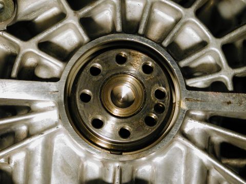 1996 Ford Probe - A detailed view of an engine part, showing its metallic texture and construction.