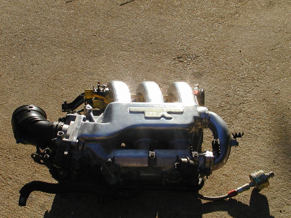 Engine intake manifold with 'DOHC' and '24V' visible on the side