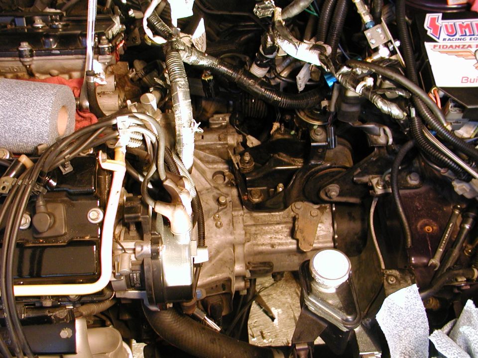 Engine bay with visible wiring and engine components. Text 'SUMMIT RACING EQUIPMENT' visible