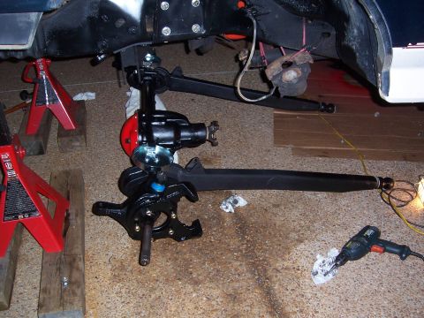 1992 Ford Bronco - Close-up of vehicle front suspension and steering components during maintenance.